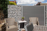 Sichtschutz aus Gabionen: befüllter Gabionenkorb JUMBO an einer Terrasse mit Gartenmöbeln